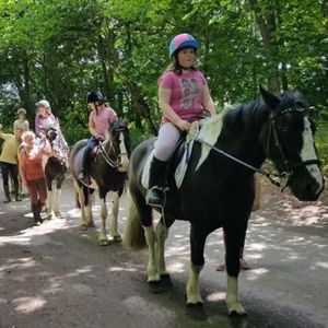 Children on a horse ride with Woldgate Riding Centre