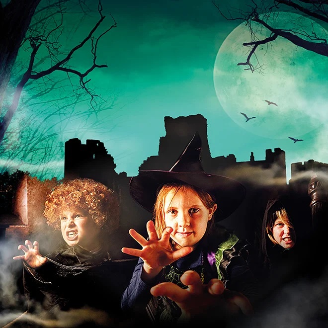 children in halloween costumes with castle ruins graphic in the background