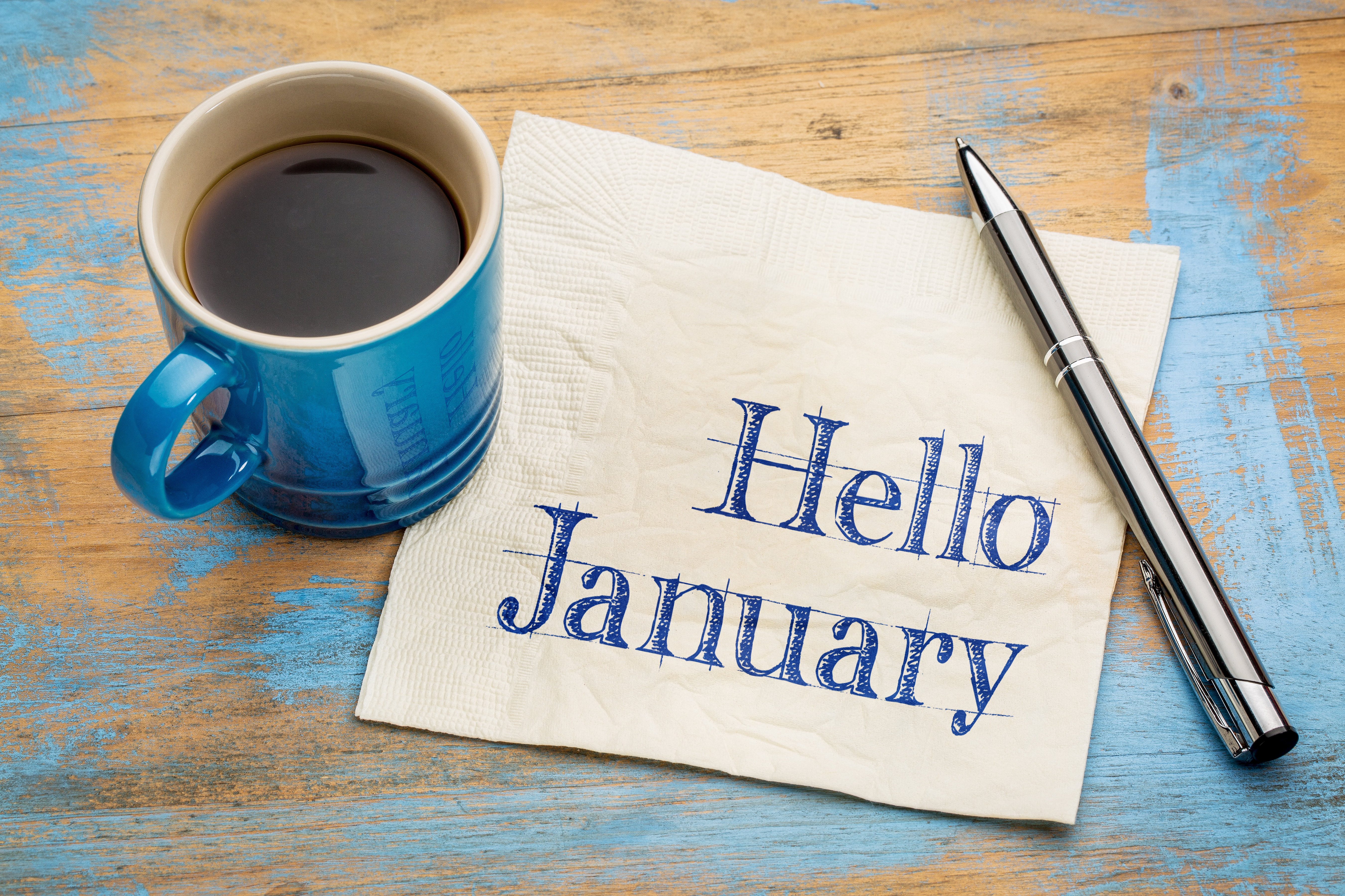 Hello January logo with pen and coffee cup