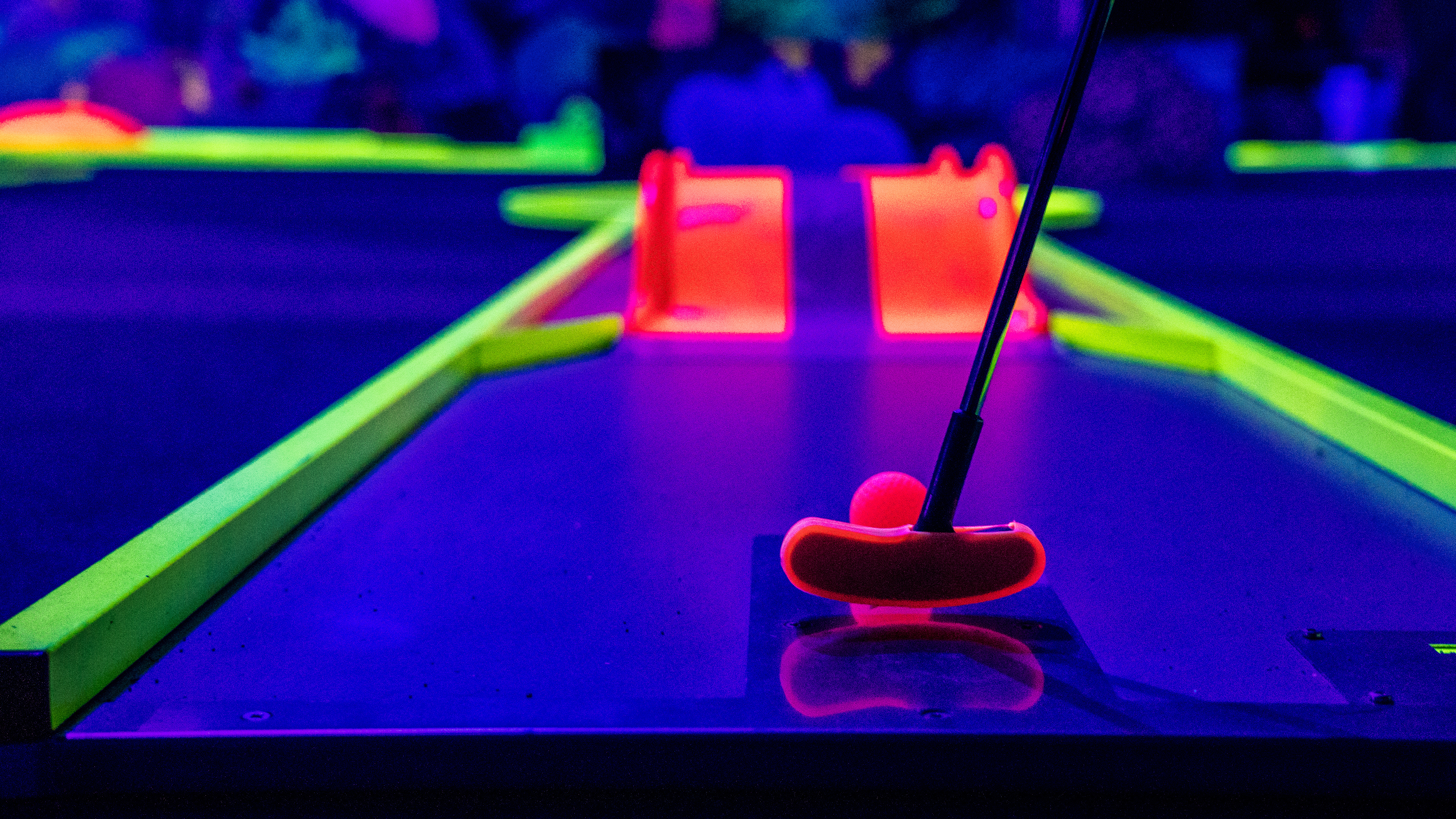 Neon lit indoor mini-golf course