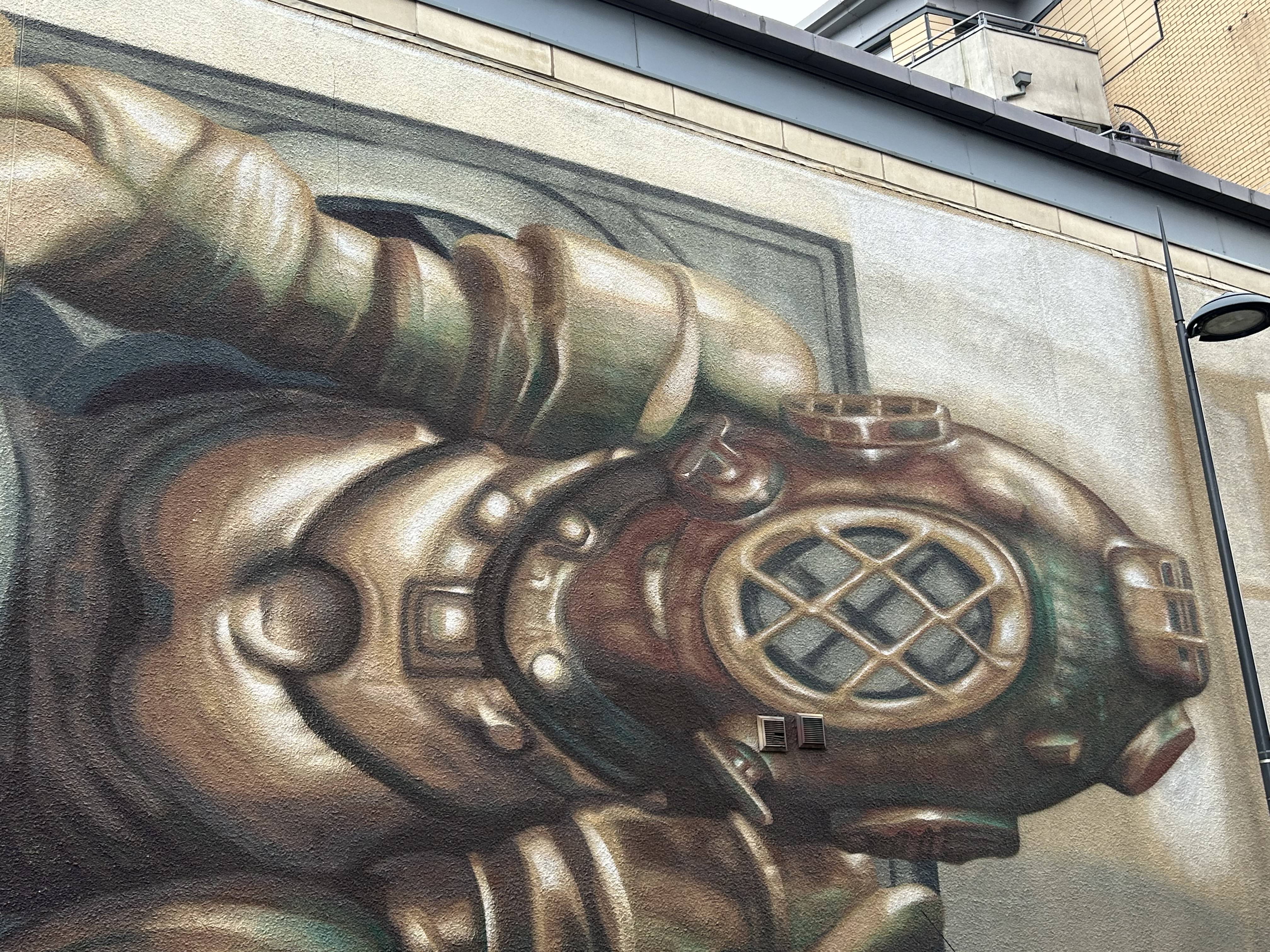 deep sea diver street art on a leeds city centre wall