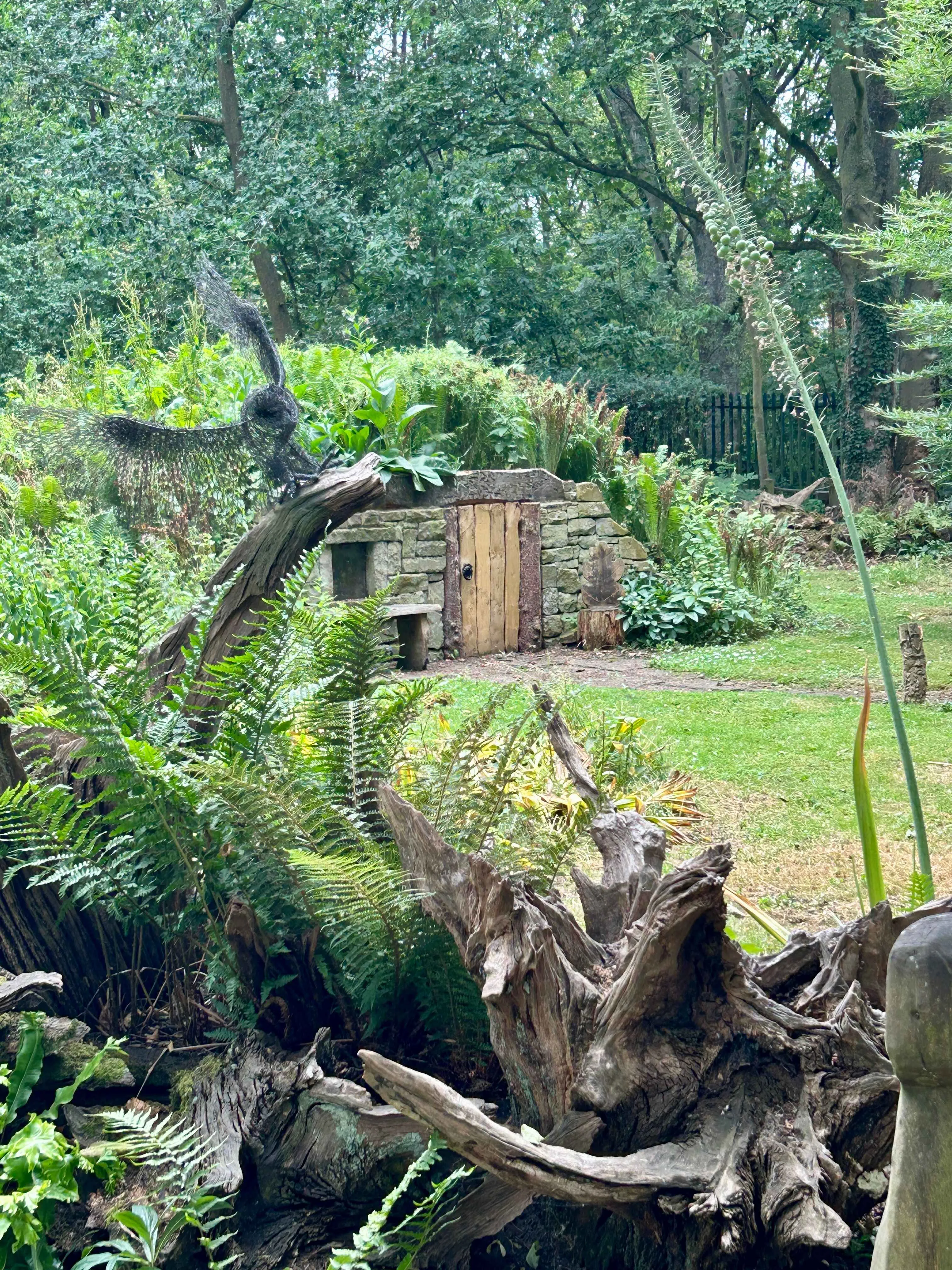 Hobbit house in the stumpery woodland gardens at Burnby Hall Gardens