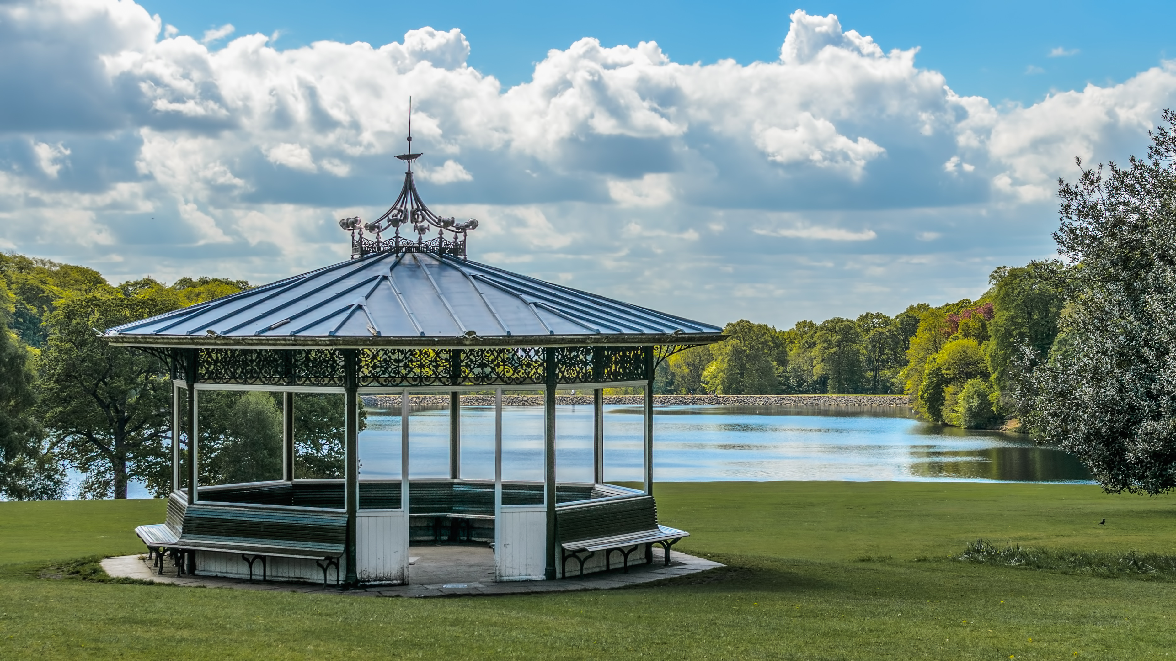 bandstand in Roundhay Park in Leeds, with a lake behind.