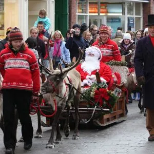 Santa in a sleigh being pulled through the town of Beverley