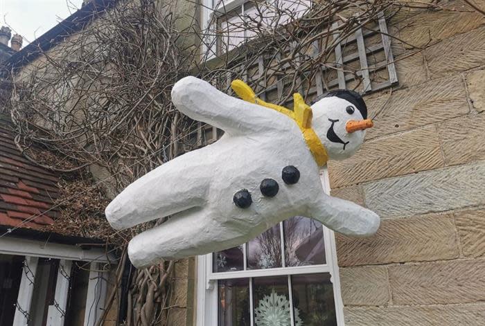 snowman model flying through the air 