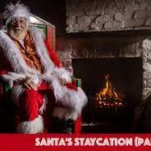 Father Christmas by a fireplace