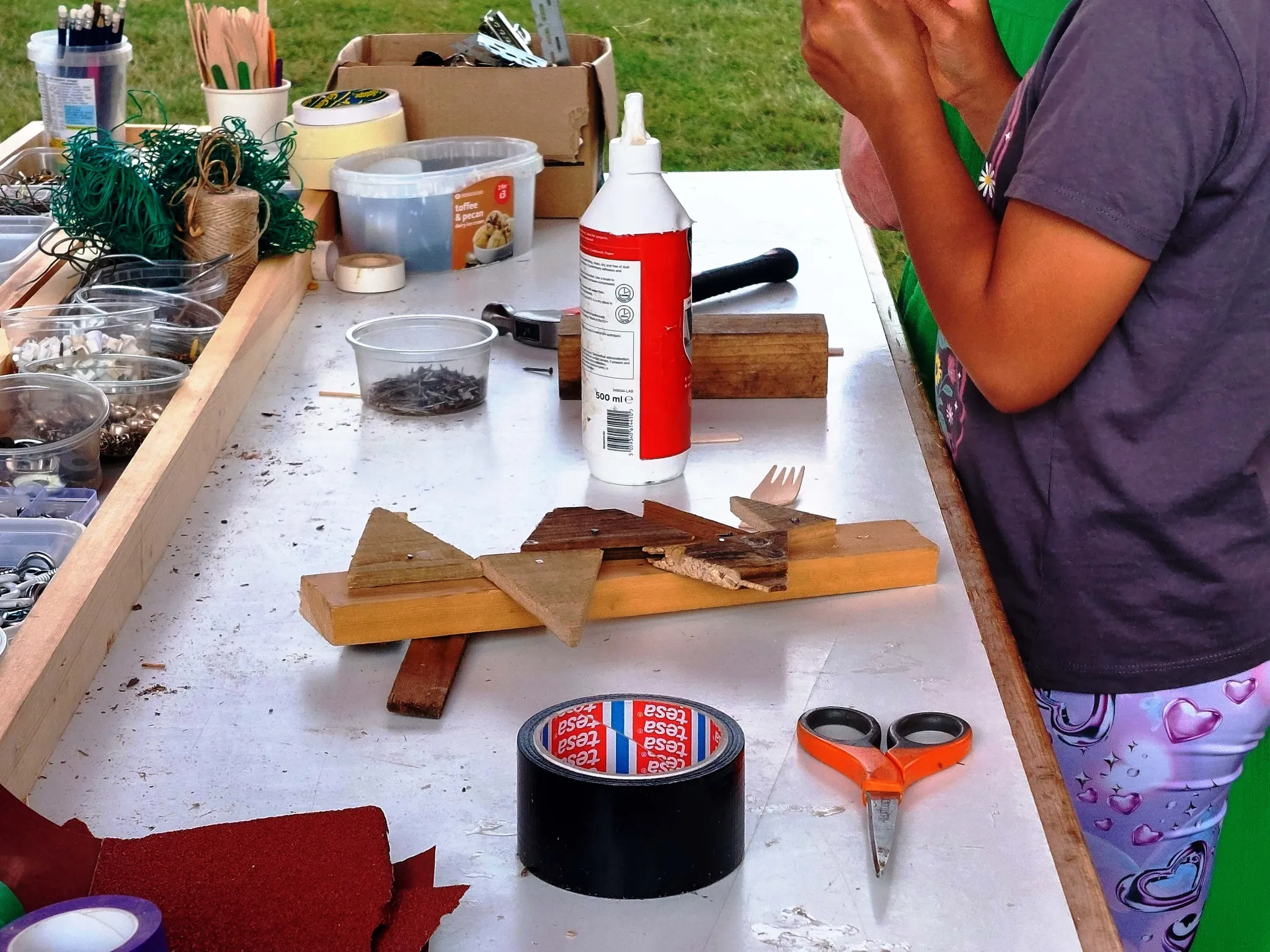 bench with woodworking tools, glue and scisosrs for wood crafts