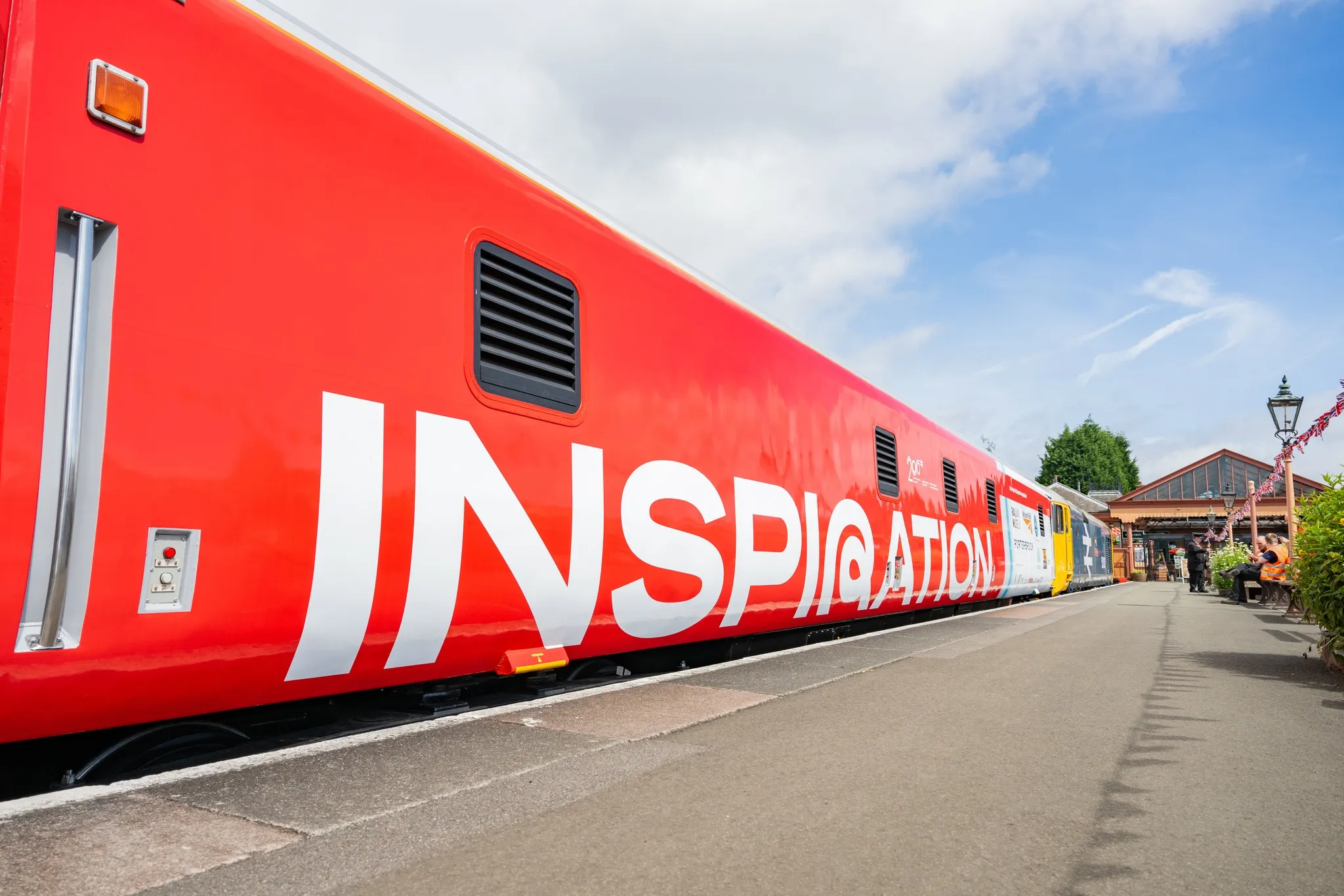 Inspiration Train parked by a station