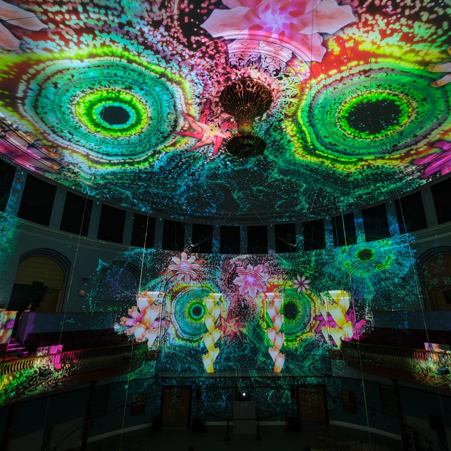 brightly coloured light patterns on a ceiling and wall