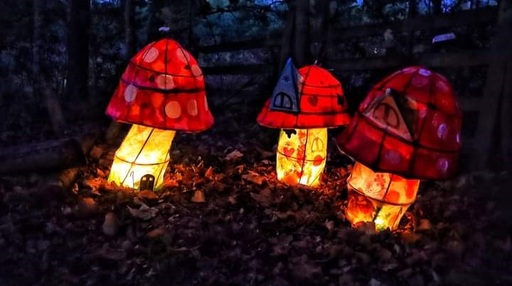three red and whote toadstool lanterns