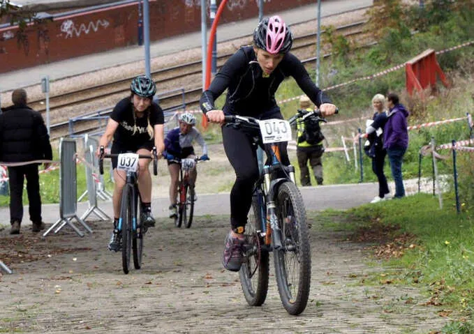 cyclists pedalling up the steep park hill course