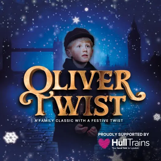 small boy dressed as Oliver Twist.