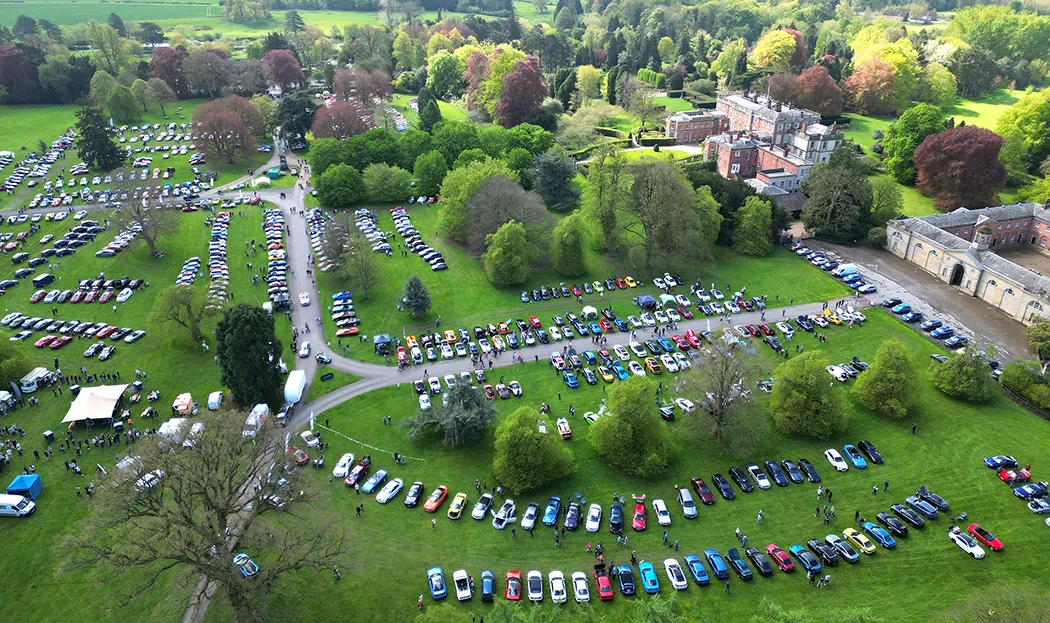 aerial view of newby hall parlands filled with sports cars.